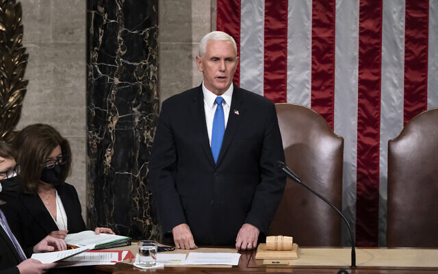 Vice President Mike Pence, returns to the House chamber after midnight, Jan. 7, 2021, to finish the work of the Electoral College after a mob loyal to President Donald Trump stormed the Capitol in Washington and disrupted the process. (AP Photo/J. Scott Applewhite, File) Vice President Mike Pence, returns to the House chamber after midnight, Jan. 7, 2021, to finish the work of the Electoral College after a mob loyal to President Donald Trump stormed the Capitol in Washington and disrupted the process. (AP Photo/J. Scott Applewhite, File)