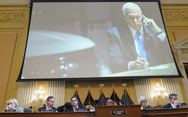 A committee exhibit shows former US vice president Mike Pence talking on the phone from his secure location during the riot, as the House select committee investigating the January 6, 2021, attack on the Capitol holds a hearing at the Capitol in Washington, June 16, 2022. (AP Photo/Susan Walsh) A committee exhibit shows former US vice president Mike Pence talking on the phone from his secure location during the riot, as the House select committee investigating the January 6, 2021, attack on the Capitol holds a hearing at the Capitol in Washington, June 16, 2022. (AP Photo/Susan Walsh)