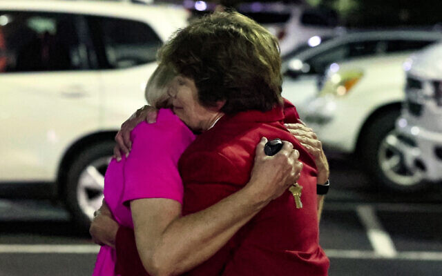 Church members console each other after a shooting at the Saint Stevens Episcopal Church on Thursday, June 16, 2022 in Vestavia, Alabama. (AP Photo/Butch Dill) Church members console each other after a shooting at the Saint Stevens Episcopal Church on Thursday, June 16, 2022 in Vestavia, Alabama. (AP Photo/Butch Dill)