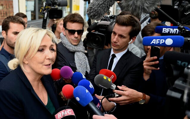 French far-right leader Marine Le Pen addresses reporters June 20, 2022, in Henin-Beaumont, northern France. (AP Photo) French far-right leader Marine Le Pen addresses reporters June 20, 2022, in Henin-Beaumont, northern France. (AP Photo)