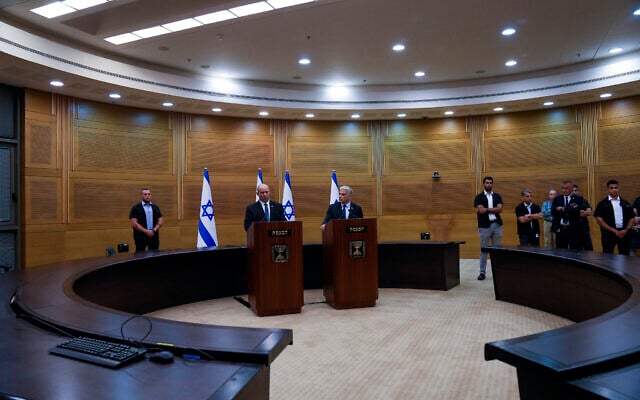 Israeli Prime Minister Naftali Bennett, left, announces the collapse of his coalition government during a joint statement with Foreign Minister Yair Lapid, at the Knesset, June 20, 2022. (AP Photo/Maya Alleruzzo) Israeli Prime Minister Naftali Bennett, left, announces the collapse of his coalition government during a joint statement with Foreign Minister Yair Lapid, at the Knesset, June 20, 2022. (AP Photo/Maya Alleruzzo)