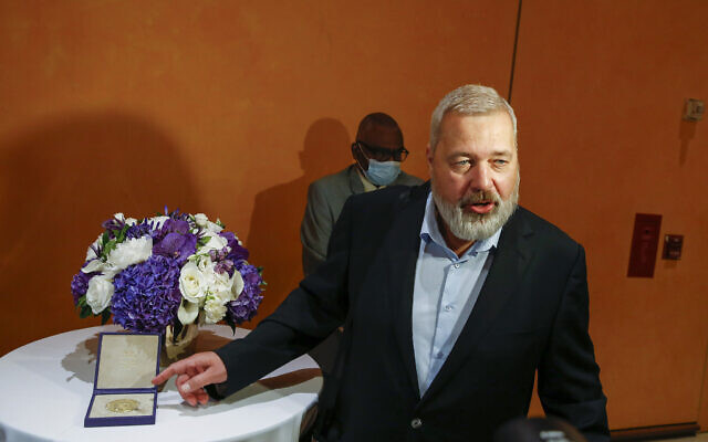 Nobel Peace Prize winner Dmitry Muratov, editor-in-chief of the influential Russian newspaper Novaya Gazeta, poses for a picture next to his 23-karat gold medal before it is auctioned at the Times Center, Monday, June 20, 2022, in New York. (AP Photo/Eduardo Munoz Alvarez) Nobel Peace Prize winner Dmitry Muratov, editor-in-chief of the influential Russian newspaper Novaya Gazeta, poses for a picture next to his 23-karat gold medal before it is auctioned at the Times Center, Monday, June 20, 2022, in New York. (AP Photo/Eduardo Munoz Alvarez)