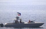 Illustrative: A boat of Iran's Islamic Revolutionary Guard Corps Navy operates in close proximity to patrol coastal ship USS Sirocco and expeditionary fast transport USNS Choctaw County in the Strait of Hormuz, June 20, 2022. (US Navy via AP)