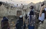 Afghans look at destruction caused by an earthquake in the province of Paktika, eastern Afghanistan, June 22, 2022. (Bakhtar News Agency via AP)