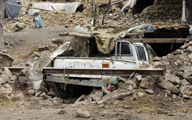 An Afghan villager sits near his damaged house that was destroyed in an earthquake in the Spera District of the southwestern part of Khost Province, Afghanistan, June 22, 2022. (AP Photo)