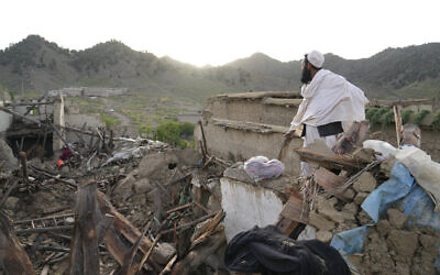 A man stands among destruction after an earthquake in Gayan village, Afghanistan, June 23, 2022. (AP Photo/Ebrahim Nooroozi)
