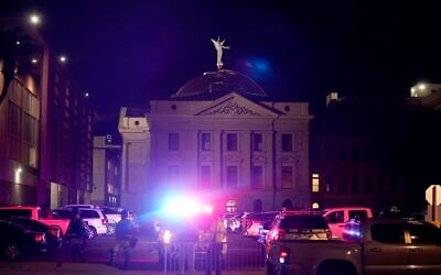 A large number of police surround the Arizona Capitol after protesters reached the front of the AZ Senate building following the Supreme Court's decision to overturn Roe v. Wade, June 24, 2022, in Phoenix. (AP Photo/Ross D. Franklin)