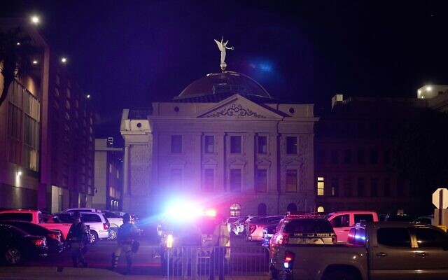A large number of police surround the Arizona Capitol after protesters reached the front of the AZ Senate building following the Supreme Court's decision to overturn Roe v. Wade, June 24, 2022, in Phoenix. (AP Photo/Ross D. Franklin) A large number of police surround the Arizona Capitol after protesters reached the front of the AZ Senate building following the Supreme Court's decision to overturn Roe v. Wade, June 24, 2022, in Phoenix. (AP Photo/Ross D. Franklin)