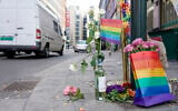 Flowers are left at the scene of a shooting in central Oslo, June 25, 2022. (Hakon Mosvold Larsen/NTB Scanpix via AP)