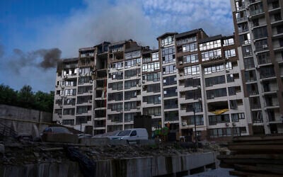 Smoke billows the air from a residential buildings following explosions, in Kyiv, Ukraine, June 26, 2022. (Nariman El-Mofty/AP)