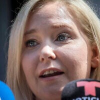 Virginia Roberts Giuffre, who sued wealthy financier Jeffrey Epstein over alleged sexual abuse and accused him and Ghislaine Maxwell of pressuring her into sexual trysts with other powerful men, speaks during a news conference outside a Manhattan court in New York, August 27, 2019. (AP Photo/Bebeto Matthews, File)