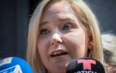 Virginia Roberts Giuffre, who sued wealthy financier Jeffrey Epstein over alleged sexual abuse and accused him and Ghislaine Maxwell of pressuring her into sexual trysts with other powerful men, speaks during a news conference outside a Manhattan court in New York, August 27, 2019. (AP Photo/Bebeto Matthews, File)