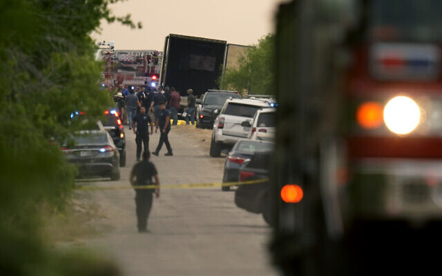 Body bags lie at the scene where a tractor trailer with multiple dead bodies was discovered, in San Antonio, June 27, 2022. (Eric Gay/AP) Body bags lie at the scene where a tractor trailer with multiple dead bodies was discovered, in San Antonio, June 27, 2022. (Eric Gay/AP)