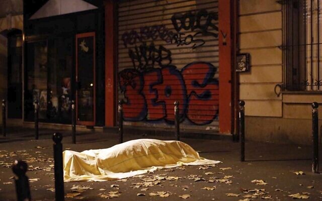 A victim under a blanket lays dead outside the Bataclan theater in Paris, Nov. 13, 2015. (AP Photo/Jerome Delay) A victim under a blanket lays dead outside the Bataclan theater in Paris, Nov. 13, 2015. (AP Photo/Jerome Delay)