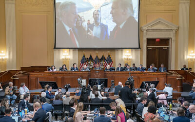 A image of former President Donald Trump talking to his Chief of Staff Mark Meadows is seen as Cassidy Hutchinson, former aide to Trump White House chief of staff Mark Meadows, testifies as the House select committee investigating the Jan. 6 attack on the U.S. Capitol holds a hearing at the Capitol in Washington, Tuesday, June 28, 2022. (Sean Thew/Pool via AP)