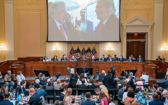 A image of former President Donald Trump talking to his Chief of Staff Mark Meadows is seen as Cassidy Hutchinson, former aide to Trump White House chief of staff Mark Meadows, testifies as the House select committee investigating the Jan. 6 attack on the U.S. Capitol holds a hearing at the Capitol in Washington, Tuesday, June 28, 2022. (Sean Thew/Pool via AP)