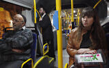 Illustrative: Secular Israelis board a gender-segregated bus where women sit in the back of the bus, and men in the front. The secular women sat among ultra-Orthodox Jewish men in the front, as part of a protest against the exclusion of women in the public sphere, January 1, 2012. (Miriam Alster / Flash90)