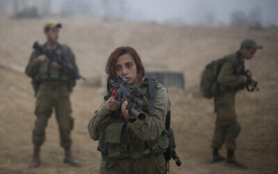 Soldiers of the Bardales Battalion prepare for urban warfare training on an early foggy morning, near Nitzanim in the Arava area of southern Israel, on July 13, 2016. (Hadas Parush/Flash90)