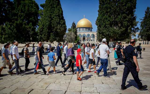 Religious Jews are escorted by Israeli police as they tour the Temple Mount in Jerusalem's Old City during the Jewish holiday of Sukkot on September 24, 2018. (Sliman Khader/Flash90)