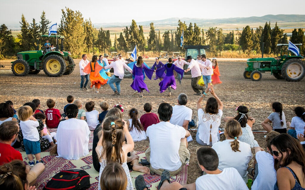 Israelis seen at a celebration for the Jewish holiday of Shavuot in Kibbutz Sarid, in Emek Yizrael on May 16, 2021. (Anat Hermony/Flash90)