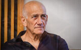 Former prime minister Ehud Olmert arrives for a court hearing related to the Netanyahu family lawsuit against him, at the Tel Aviv Magistrate's Court on June 12, 2022. (Avshalom Sassoni/Flash90)