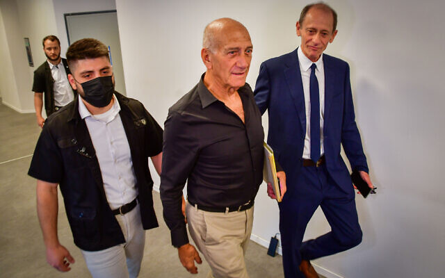 Former prime minister Ehud Olmert arrives for a court hearing on the lawsuit of the Netanyahu family against him, at the Tel Aviv Magistrate's Court on June 12, 2022. (Avshalom Sassoni/Flash90)