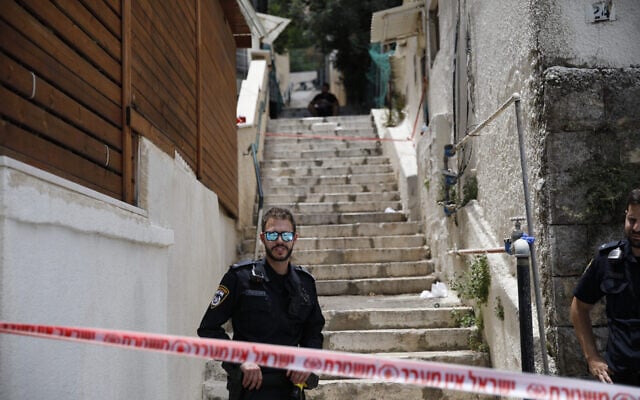 Police at the scene where a man murdered his wife and then tried to kill himself on June 12, 2022, in Haifa (Shir Torem/Flash90) Police at the scene where a man murdered his wife and then tried to kill himself on June 12, 2022, in Haifa (Shir Torem/Flash90)