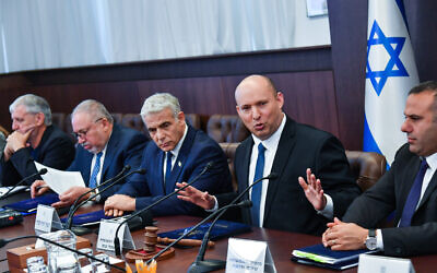 Prime Minister Naftali Bennett (2nd right) and Yair Lapid (C) at the cabinet meeting at the Prime Minister's Office in Jerusalem on June 12, 2022 (Yoav Ari Dudkevitch/POOL) Prime Minister Naftali Bennett (2nd right) and Yair Lapid (C) at the cabinet meeting at the Prime Minister's Office in Jerusalem on June 12, 2022 (Yoav Ari Dudkevitch/POOL)