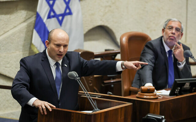 Prime Minister Naftali Bennett addresses the Knesset during a '40 signatures debate' in the plenum hall on June 13, 2022. (Yonatan Sindel/Flash90) Prime Minister Naftali Bennett addresses the Knesset during a '40 signatures debate' in the plenum hall on June 13, 2022. (Yonatan Sindel/Flash90)