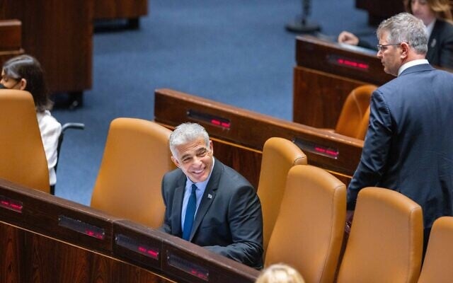 Foreign Minister Yair Lapid, the incoming interim prime minister, sits in the Knesset, during voting to dissolve parliament for new elections, on June 30, 2022. (Olivier Fitoussi/Flash90) Foreign Minister Yair Lapid, the incoming interim prime minister, sits in the Knesset, during voting to dissolve parliament for new elections, on June 30, 2022. (Olivier Fitoussi/Flash90)