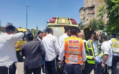 Paramedics at the scene where a four-month-old boy died after being left in a car for hours, June 30, 2022. (MDA)