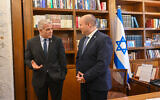 Incoming Prime Minister Yair Lapid (left) is briefed by his predecessor Naftali Bennett at the Prime Minister's Office, June 30, 2022. (Kobi Gideon / GPO)