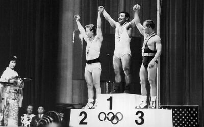 Isaac Berger, left, at the 1964 Tokyo Olympics. (Central Press/Hulton Archive/Getty Images via JTA)