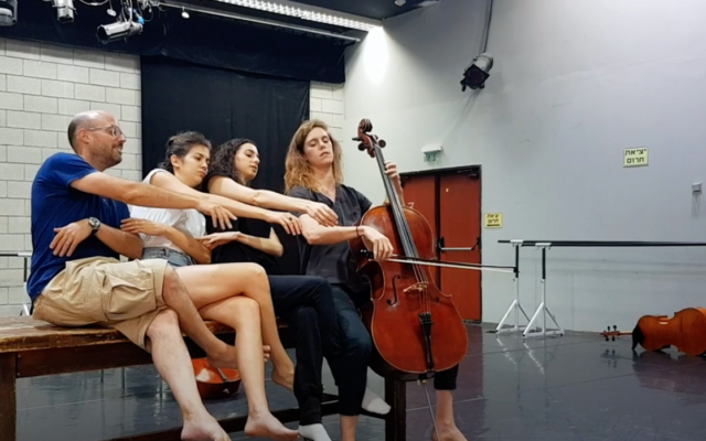 Members of the Revolution Orchestra rehearsing for their latest piece, 'Moods,' to be performed June 12, 2022 at the Tel Aviv opera house (Courtesy Revolution Orchestra YouTube screen shot) Members of the Revolution Orchestra rehearsing for their latest piece, 'Moods,' to be performed June 12, 2022 at the Tel Aviv opera house (Courtesy Revolution Orchestra YouTube screen shot)