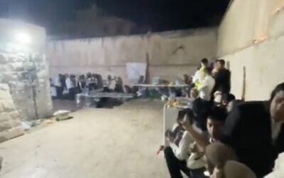 Jewish worshipers are seen at Joseph's Tomb in the northern West Bank city of Nablus on June 30, 2022, amid clashes between Palestinians and the Israel Defense Forces. (Screen capture: Twitter)