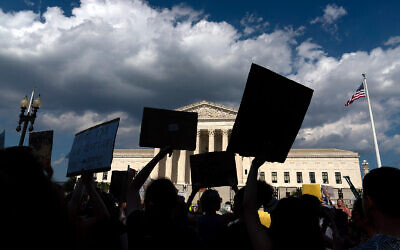 Abortion-rights activists protest outside the US Supreme Court in Washington, June 25, 2022. (AP Photo/Jose Luis Magana)