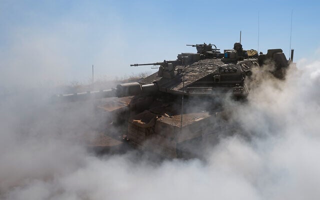An IDF tank at a military outpost overlooking Syria near the Israeli border in the Golan Heights, May 23, 2022. (Michael Giladi/Flash90)