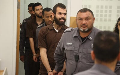 Two Palestinians accused of carrying out a deadly terror attack in Elad arrive for a court hearing in Lod, June 9, 2022. (Flash90)
