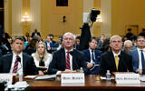 From left, former Assistant US Attorney General for the Office of Legal Counsel Steven Engel, former Acting US Attorney General Jeffrey Rosen and former Acting US Deputy Attorney General Richard Donoghue, watch video as the House select committee investigating the Jan. 6 attack on the US Capitol, June 23, 2022, at the Capitol in Washington. (Jonathan Ernst/Pool via AP)