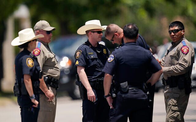 Members of law enforcement gather outside the funeral service for Jacklyn Cazares, a victim of the Uvalde shooting, at Sacred Heart Catholic Church, June 3, 2022, in Uvalde, Texas. (AP Photo/Eric Gay) Members of law enforcement gather outside the funeral service for Jacklyn Cazares, a victim of the Uvalde shooting, at Sacred Heart Catholic Church, June 3, 2022, in Uvalde, Texas. (AP Photo/Eric Gay)