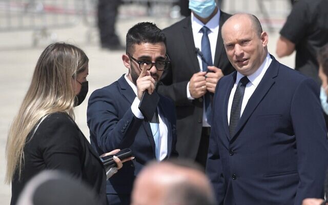 Matan Sidi (Center), departing spokesman for Prime Minister Naftali Bennett (R), in an undated photo. (Government Press Office) Matan Sidi (Center), departing spokesman for Prime Minister Naftali Bennett (R), in an undated photo. (Government Press Office)