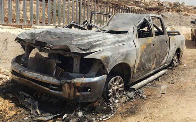 A burnt out car is seen near the West Bank village of Mughayir, after an alleged assualt by Israeli settlers, June 25, 2022. (Mughayir Council via Yesh Din) A burnt out car is seen near the West Bank village of Mughayir, after an alleged assualt by Israeli settlers, June 25, 2022. (Mughayir Council via Yesh Din)