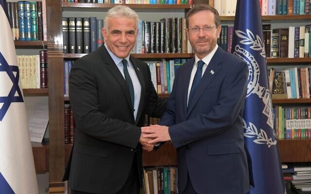 Incoming prime minister Yair Lapid (L) meets President Isaac Herzog at the President's Residence in Jerusalem on June 30, 2022. (Haim Zach/GPO) Incoming prime minister Yair Lapid (L) meets President Isaac Herzog at the President's Residence in Jerusalem on June 30, 2022. (Haim Zach/GPO)