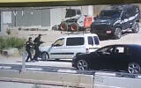 Police question a Palestinian man near the West Bank town of al-Fawwar, south of Hebron on June 8, 2022. The suspect snatched the rifle of one of the officers before driving off. (Screenshot: Twitter)