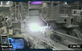 A screenshot from what is believed to be closed-circuit footage obtained from Iran's Khuzestan Steel Co. factory floor, where a piece of heavy machinery on a steel billet production line malfunctions and causes a massive fire, June 27, 2022. (Screenshot: Twitter)