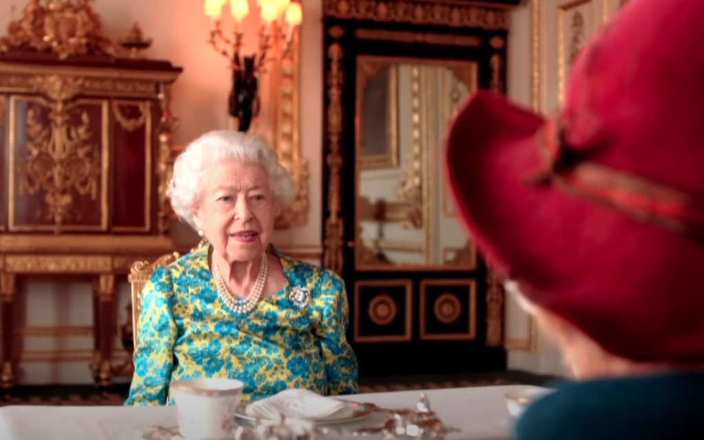 Queen Elizabeth II and Paddington Bear in a video released by the Royal Family ahead of a London concert held as part of the Platinum Jubilee celebrations, June 4, 2022. (YouTube/The Royal Family) Queen Elizabeth II and Paddington Bear in a video released by the Royal Family ahead of a London concert held as part of the Platinum Jubilee celebrations, June 4, 2022. (YouTube/The Royal Family)