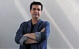 Iranian film director Jafar Panahi poses during an interview in Tehran, August 30, 2010. (Atta Kenare/AFP)