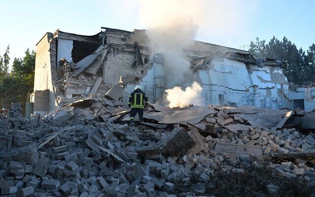Illustrative handout picture taken and released by Ukrainian Emergency Service on July 14, 2022 shows rescuers working on a residential building  partially destroyed by missile strike in the Bashtanka, Mykolaiv district amid the Russian invasion of the Ukraine. (AFP)