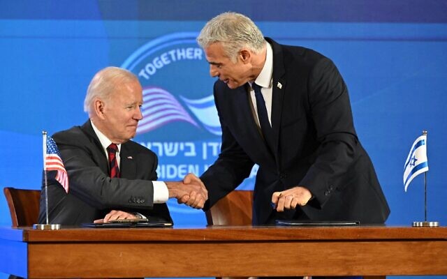 US President Joe Biden (L) and Israel's Prime Minister Yair Lapid shake hands after signinig the Jerusalem Declaration before the start of a joint press conference in Jerusalem, on July 14, 2022. (Mandel Ngan/AFP) US President Joe Biden (L) and Israel's Prime Minister Yair Lapid shake hands after signinig the Jerusalem Declaration before the start of a joint press conference in Jerusalem, on July 14, 2022. (Mandel Ngan/AFP)