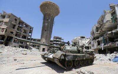 Illustrative: The Hajar al-Aswad neighborhood of the Syrian capital Damascus on July 14, 2022. (LOUAI BESHARA/AFP)